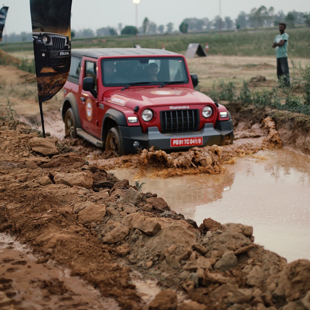 Mahindra Thar wading through muddy tracks